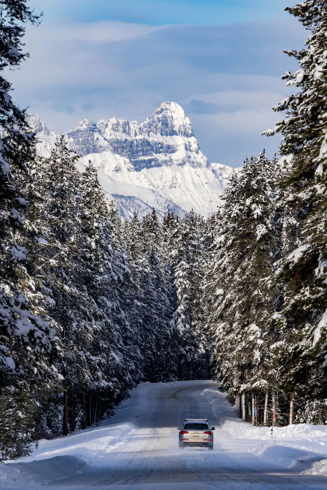 Fine-art photograph, “Snowy Road Framing a Mountain Peak - 5M2A0736.JPG,” from the British Columbia - Banff collection.