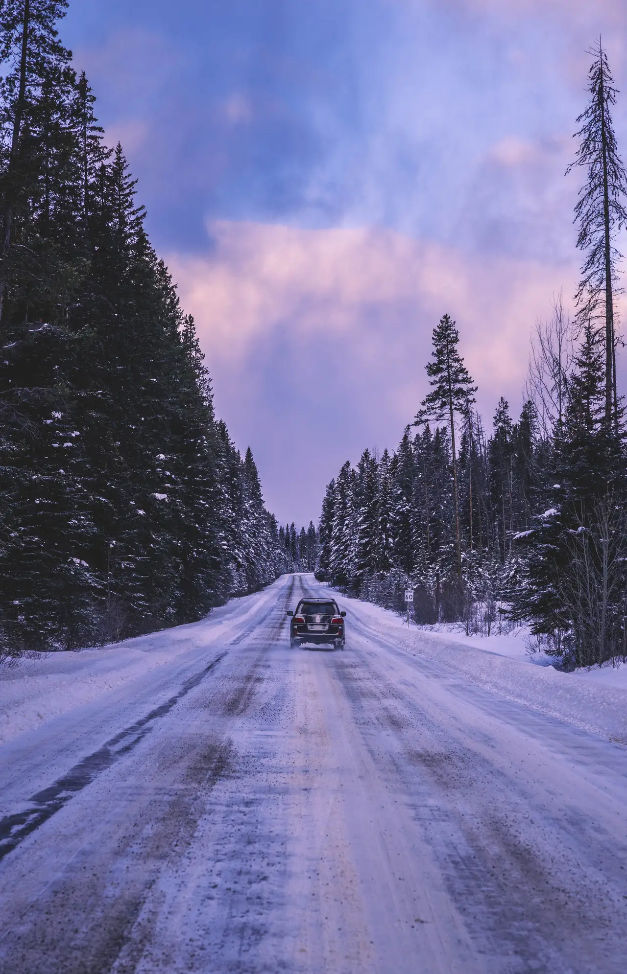 Fine-art photograph, “Snowy Banff Road with a Vehicle - 5M2A8900.JPG,” from the British Columbia - Banff collection.