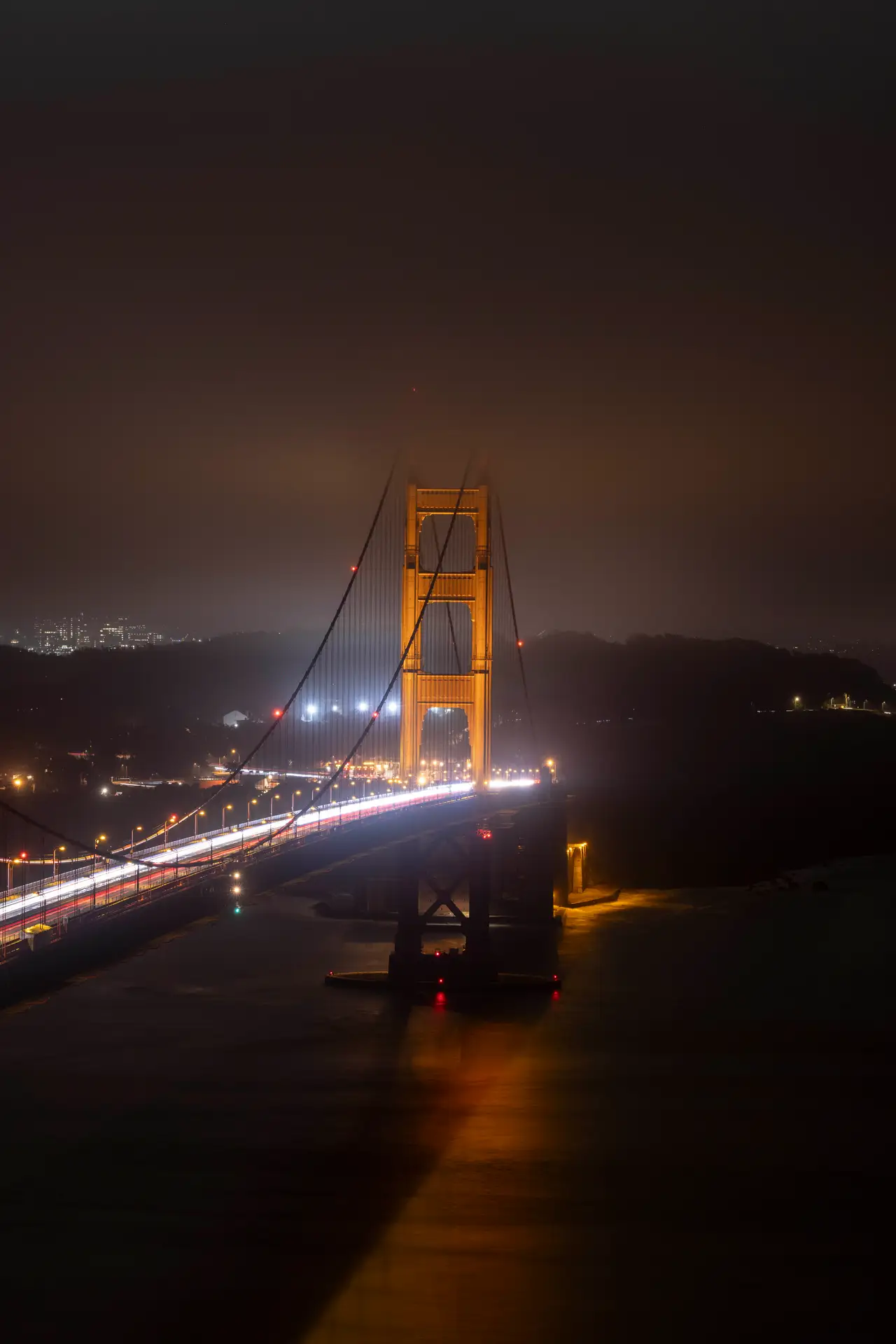 Fine-art photograph, “Golden Gate Bridge Reflected Beneath Amber Night Sky - _FIV9215.JPG,” from the California - SF - Golden Gate collection.