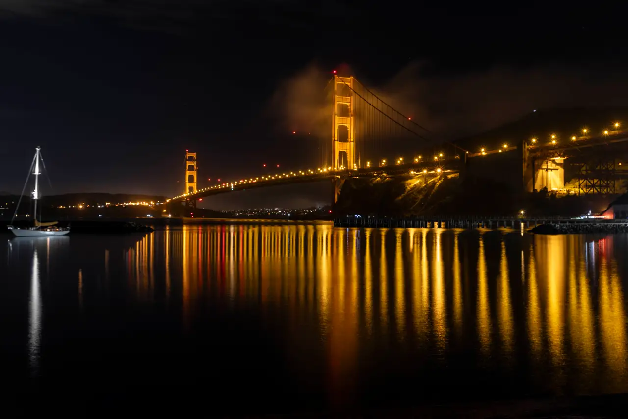 Fine-art photograph, “Golden Gate Bridge and Sailboat Reflections at Night - _FIV9279.JPG,” from the California - SF - Golden Gate collection.