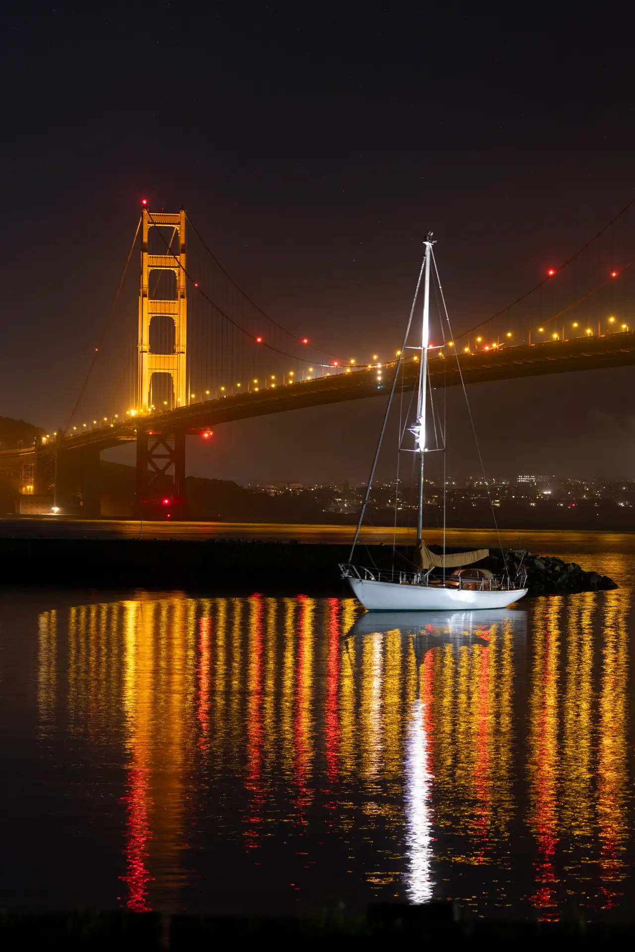 Fine-art photograph, “Golden Gate Bridge and Sailboat Reflections After Dark - _FIV9291.JPG,” from the California - SF - Golden Gate collection.