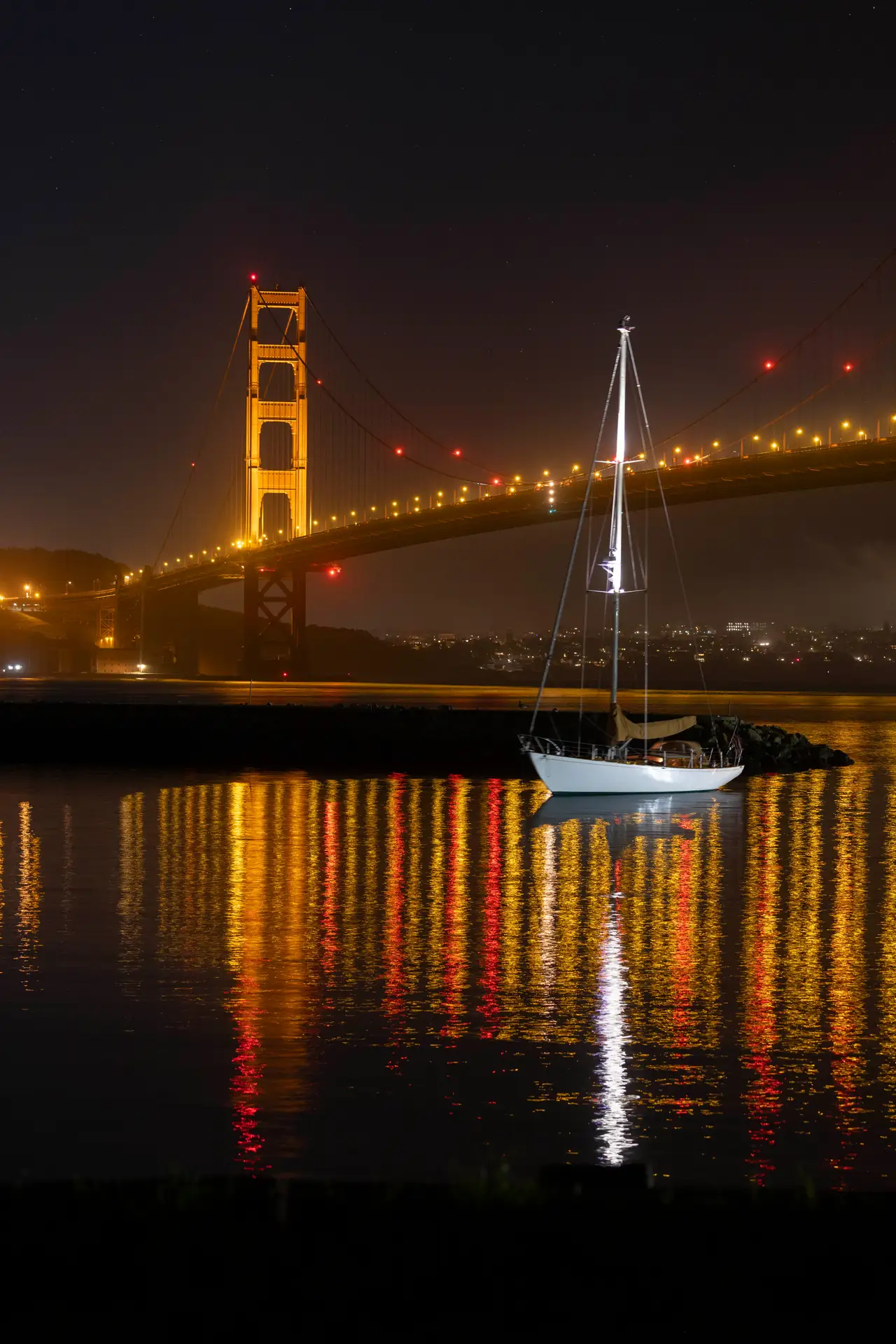 Fine-art photograph, “Golden Gate Bridge and Sailboat Across Calm Night Water - _FIV9292.JPG,” from the California - SF - Golden Gate collection.
