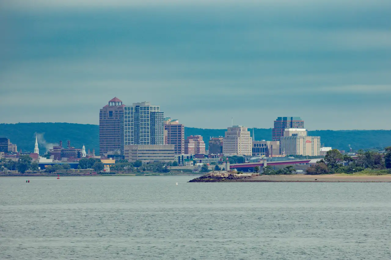 Fine-art photograph, “New Haven Waterfront Across the Harbor Under a Soft Overcast Sky - RFIV0636.JPG,” from the Connecticut collection.