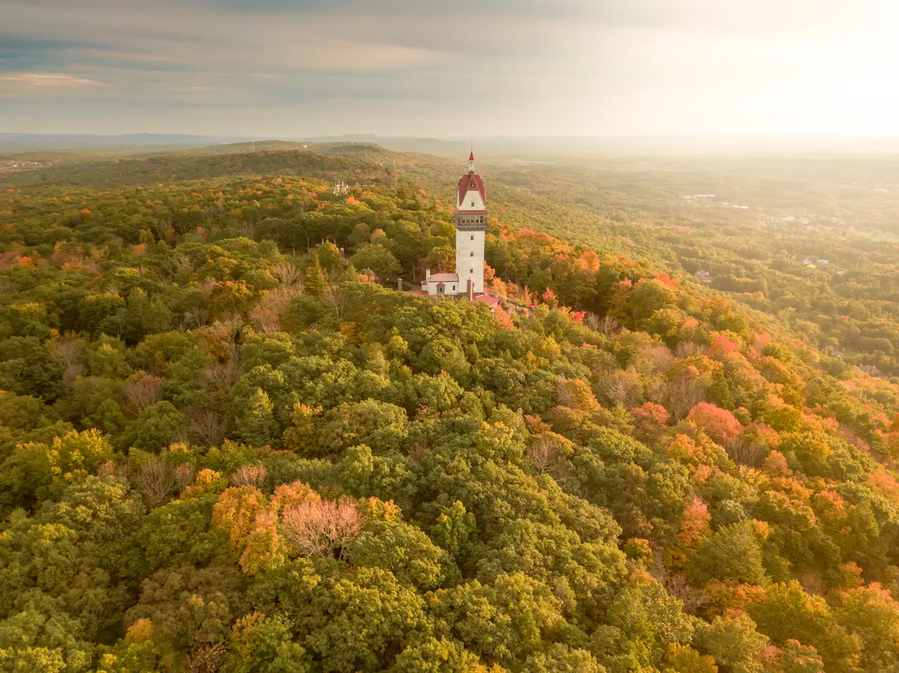 Fine-art photograph, “Heublein Tower in Golden Light Above the Autumn Hills - SimsburyDrone64.JPG,” from the Connecticut collection.