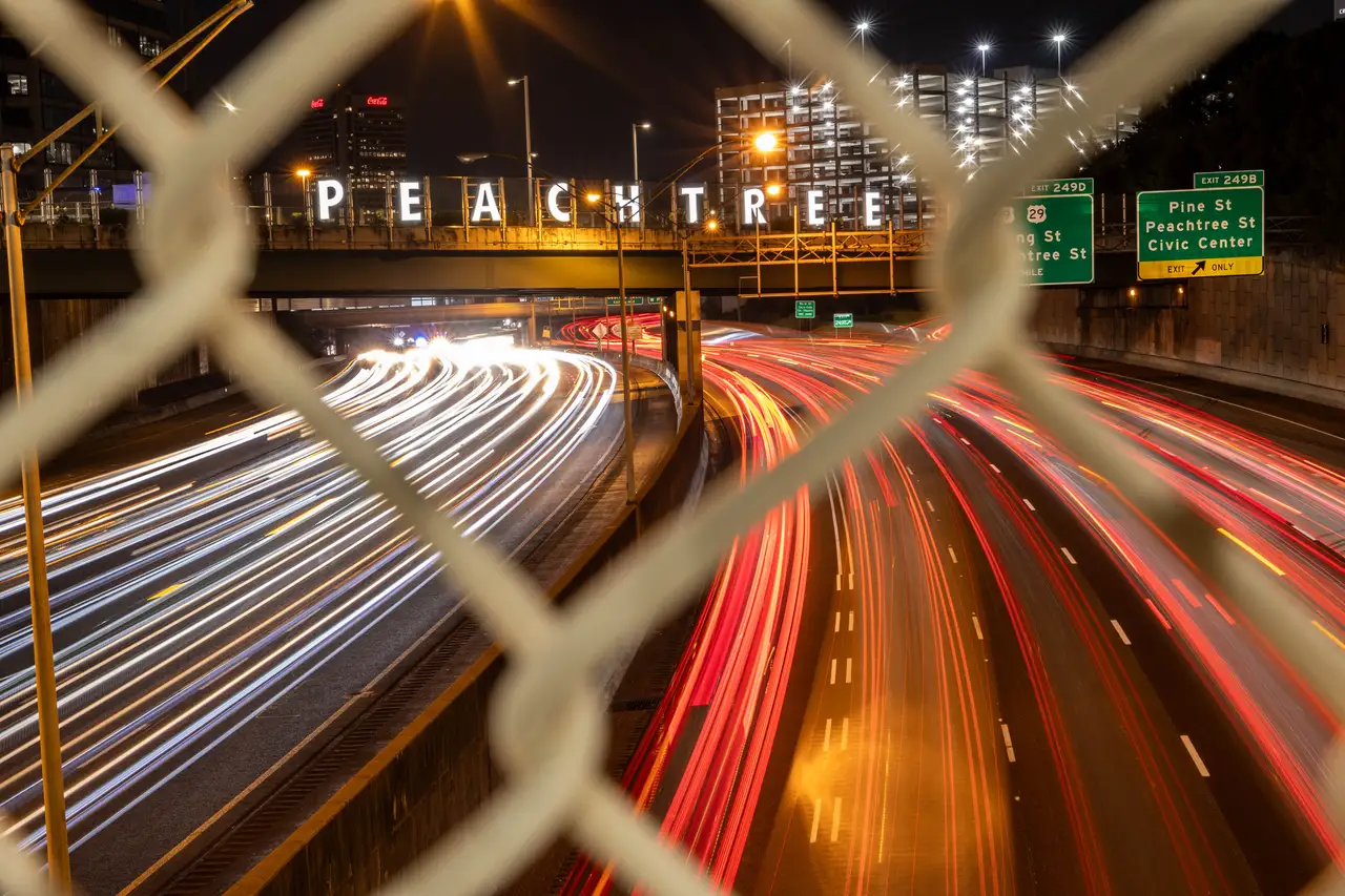 Fine-art photograph, “Peachtree Street Bridge Light Trails Through a Fence - _FIV0723.JPG,” from the Georgia - ATL collection.