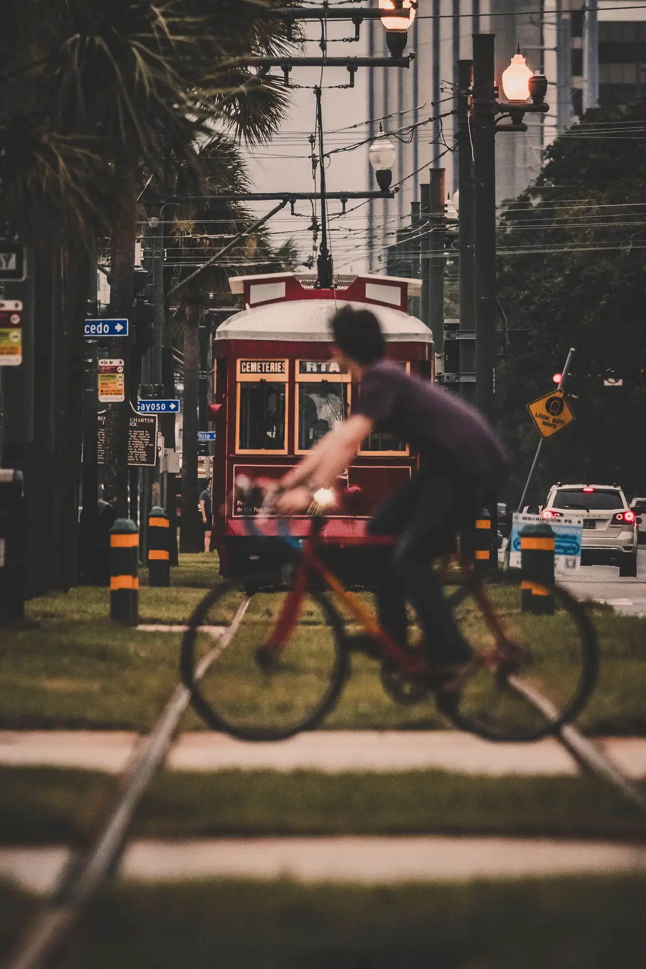 Fine-art photograph, “New Orleans Streetcar with Passing Cyclist - _FIV0549.JPG,” from the Louisiana - New Orleans collection.