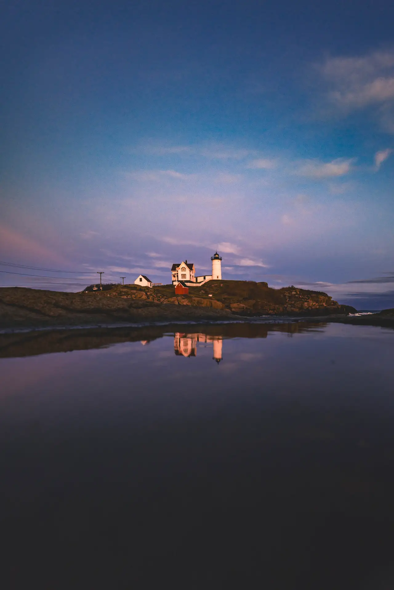 Fine-art photograph, “Nubble Lighthouse, Cape Neddick, Blue Silence - 5M2A2857.JPG,” from the Maine collection.