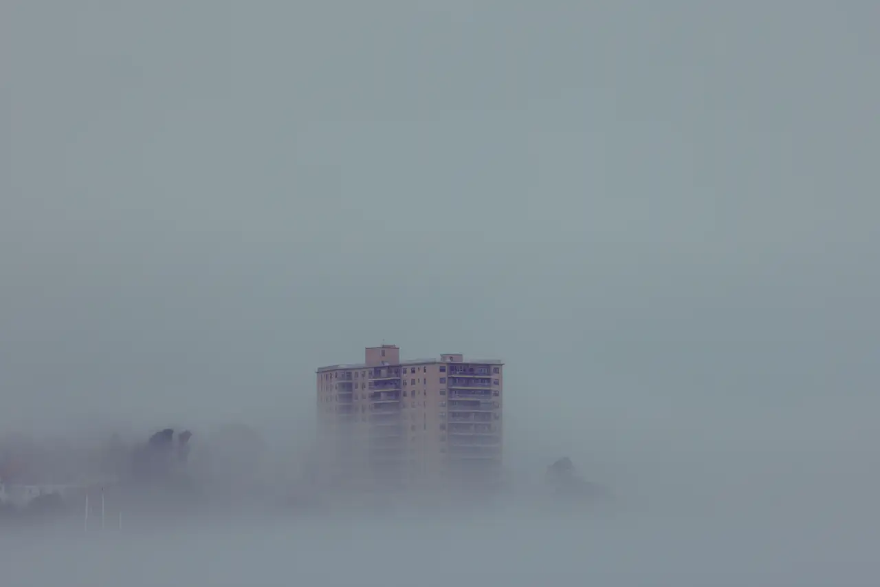 Fine-art photograph, “Portland Waterfront Building Emerging Through Harbor Fog - RFIV1220.JPG,” from the Maine collection.
