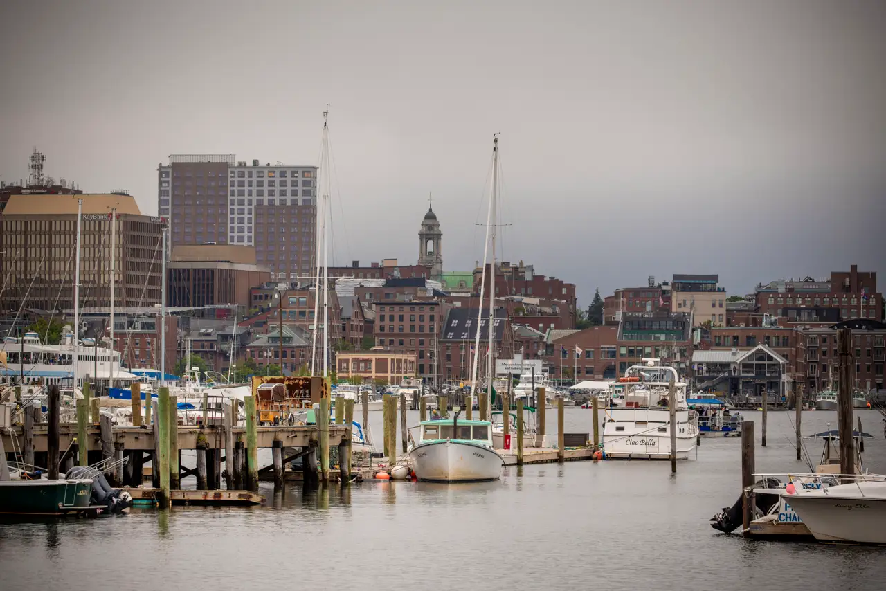 Fine-art photograph, “Portland Harbor Boats Framed by Weathered Pilings - RFIV1224.JPG,” from the Maine collection.