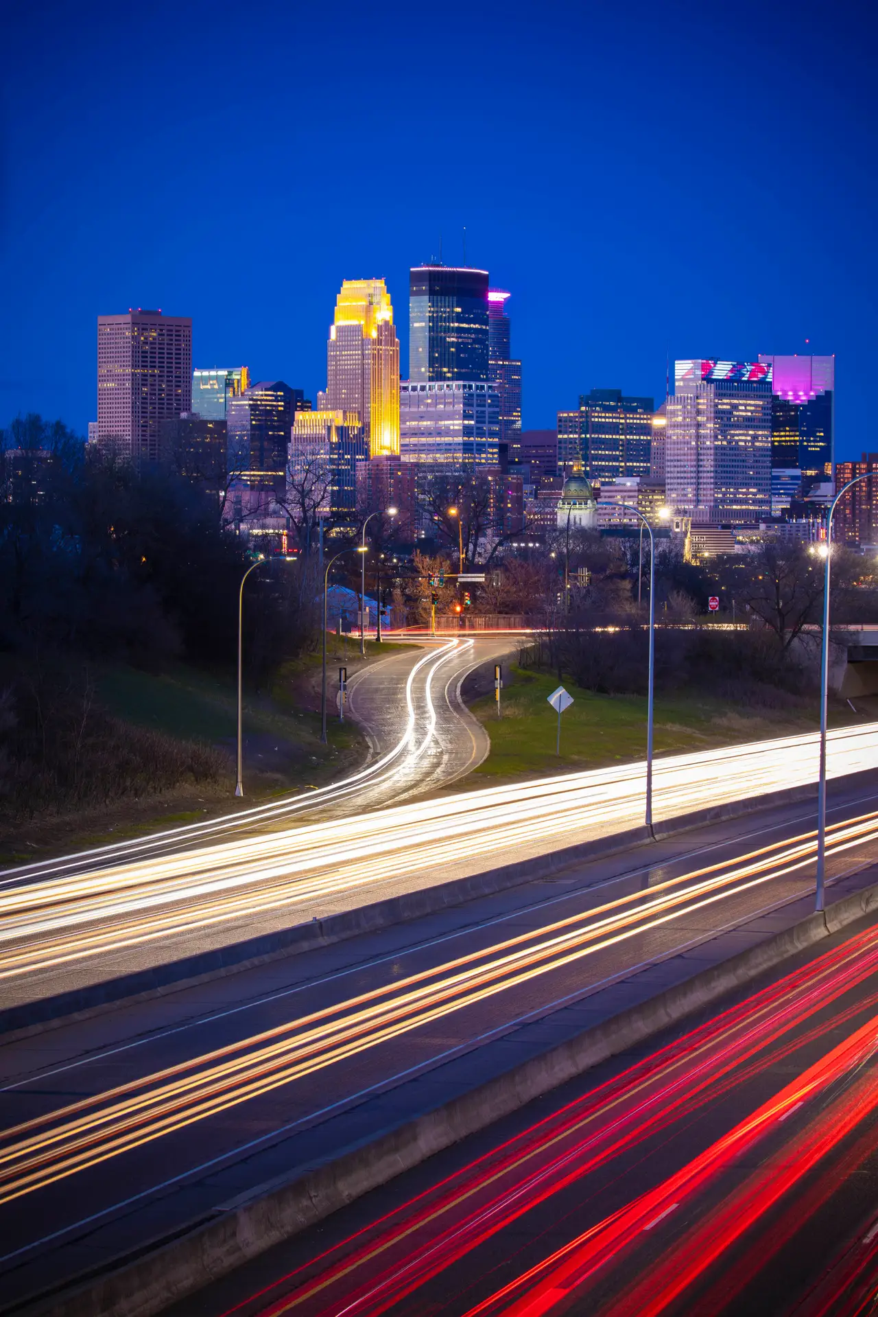Fine-art photograph, “Minneapolis Skyline Light Trails, Streetlight Current - RFIV8442.JPG,” from the Minnesota collection.