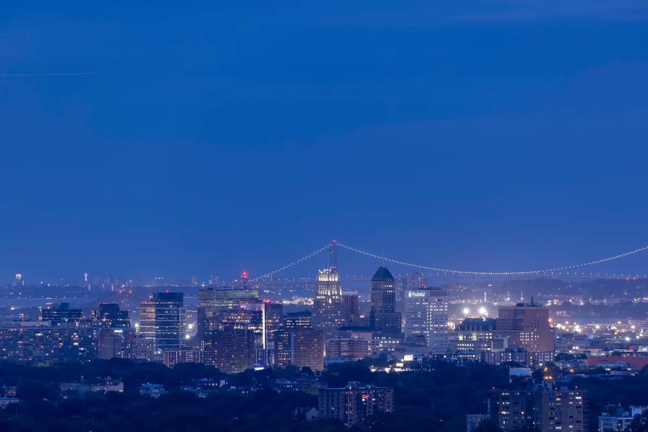 Fine-art photograph, “Newark Skyline and Pulaski Skyway at Blue Hour - RFIV9677.JPG,” from the New Jersey collection.