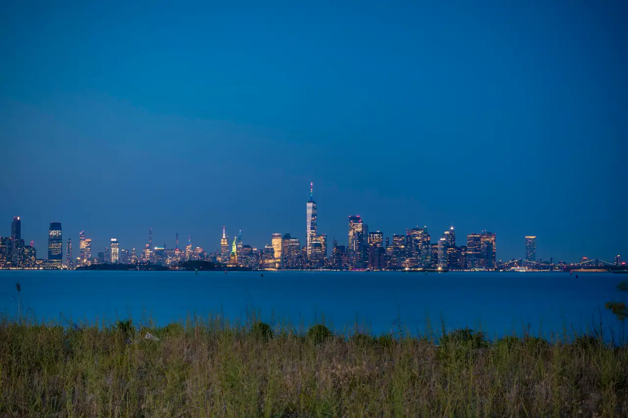 Fine-art photograph, “Lower Manhattan Across New York Harbor Beyond Harbor Grass - 5DM41147.JPG,” from the New York City collection.