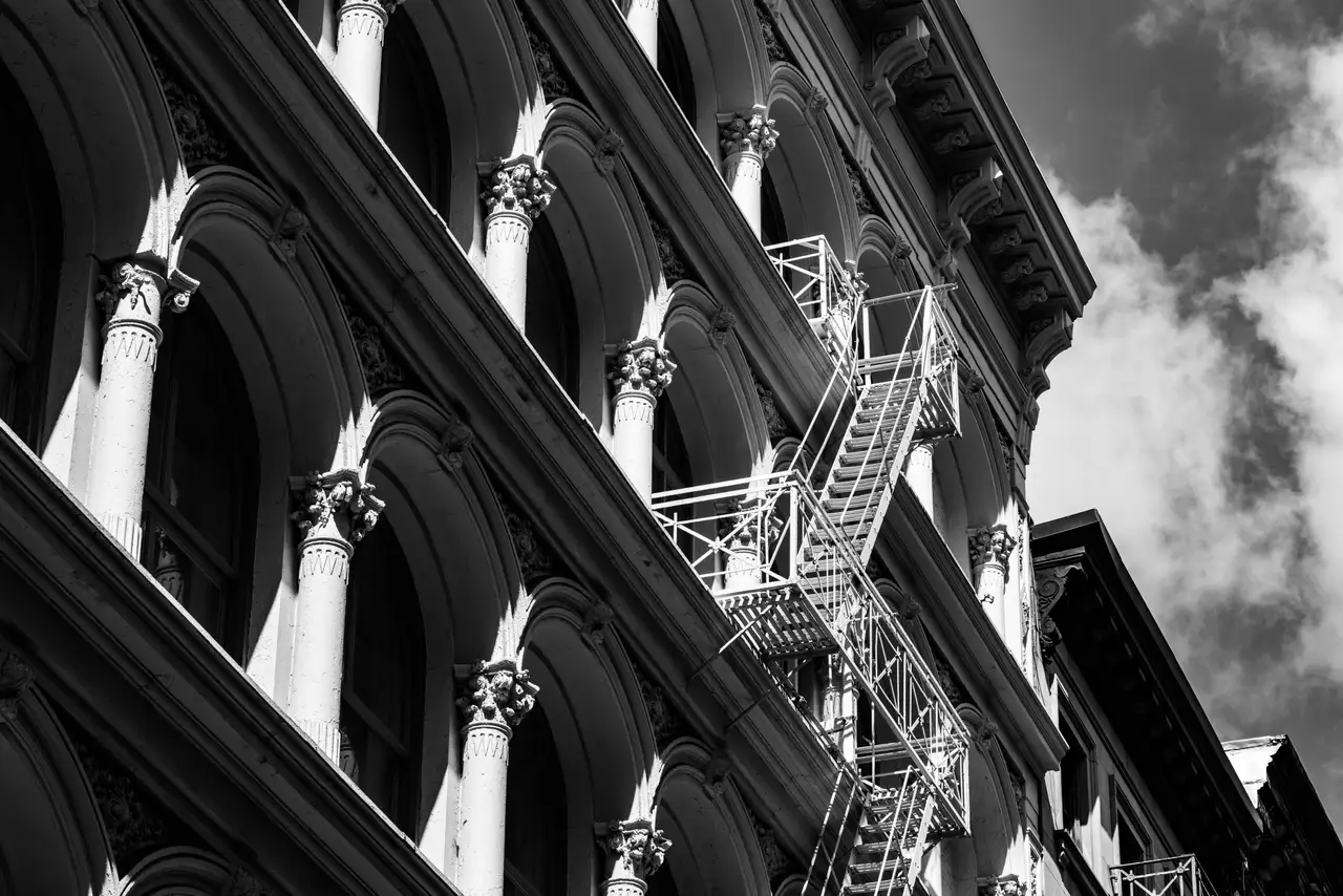 Fine-art photograph, “Manhattan Cast-Iron Facade and Fire Escape - _FIV4426.JPG,” from the New York City collection.