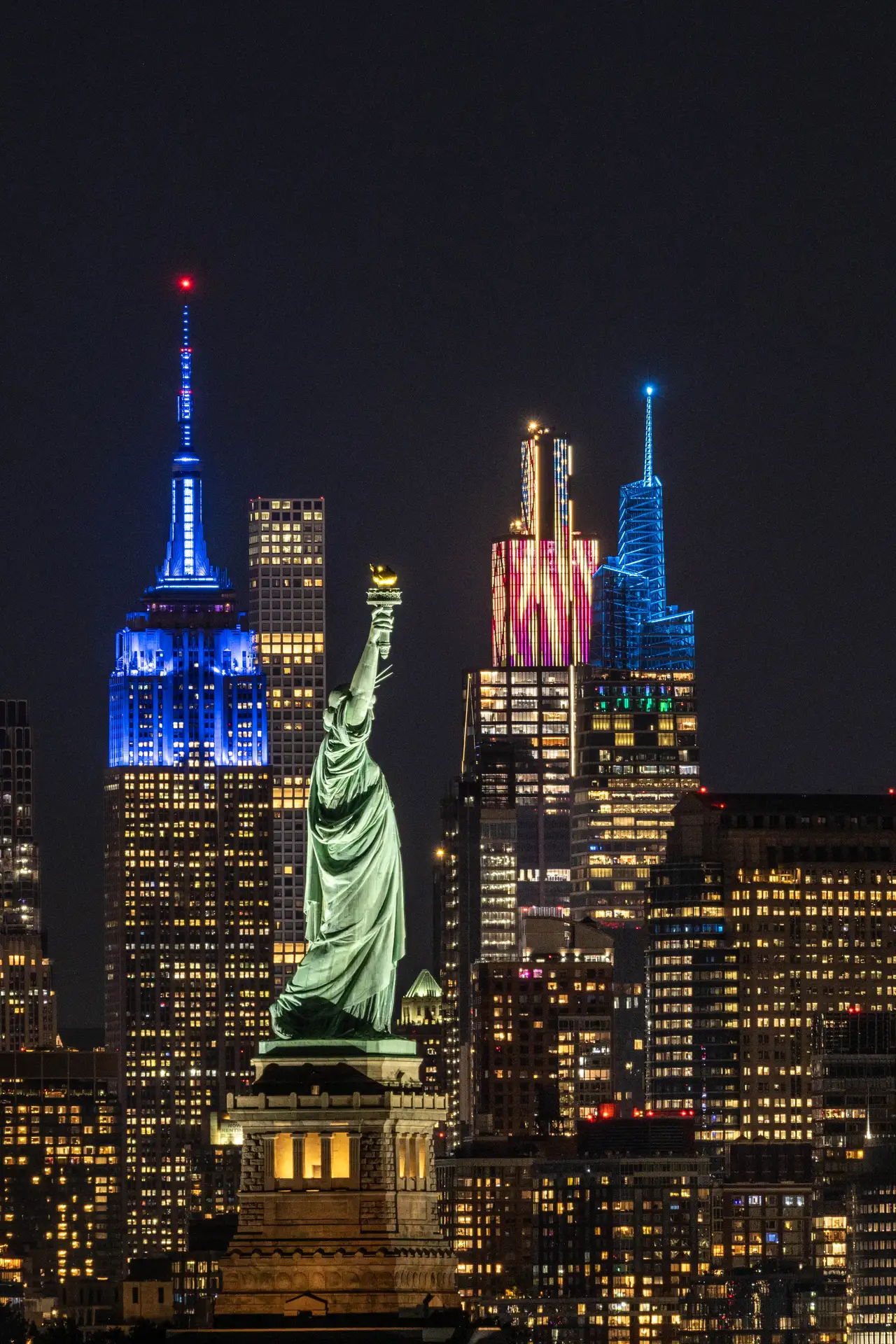 Fine-art photograph, “Statue of Liberty and Empire State in Patriotic Light, Night Passage - _FIV8308.JPG,” from the New York City collection.