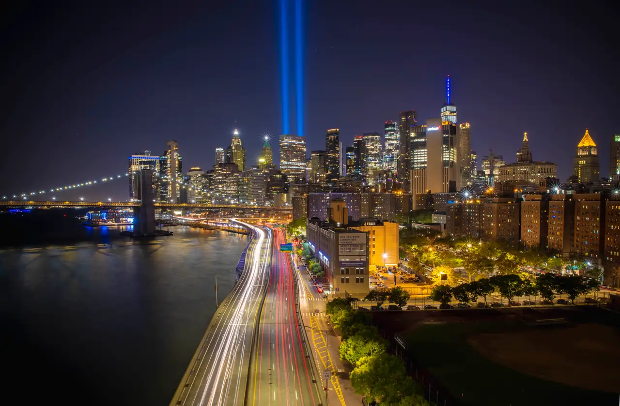 Fine-art photograph, “9/11 Tribute Lights and Brooklyn Bridge Light Trails - 9.11RFIV3406.JPG,” from the New York City collection.