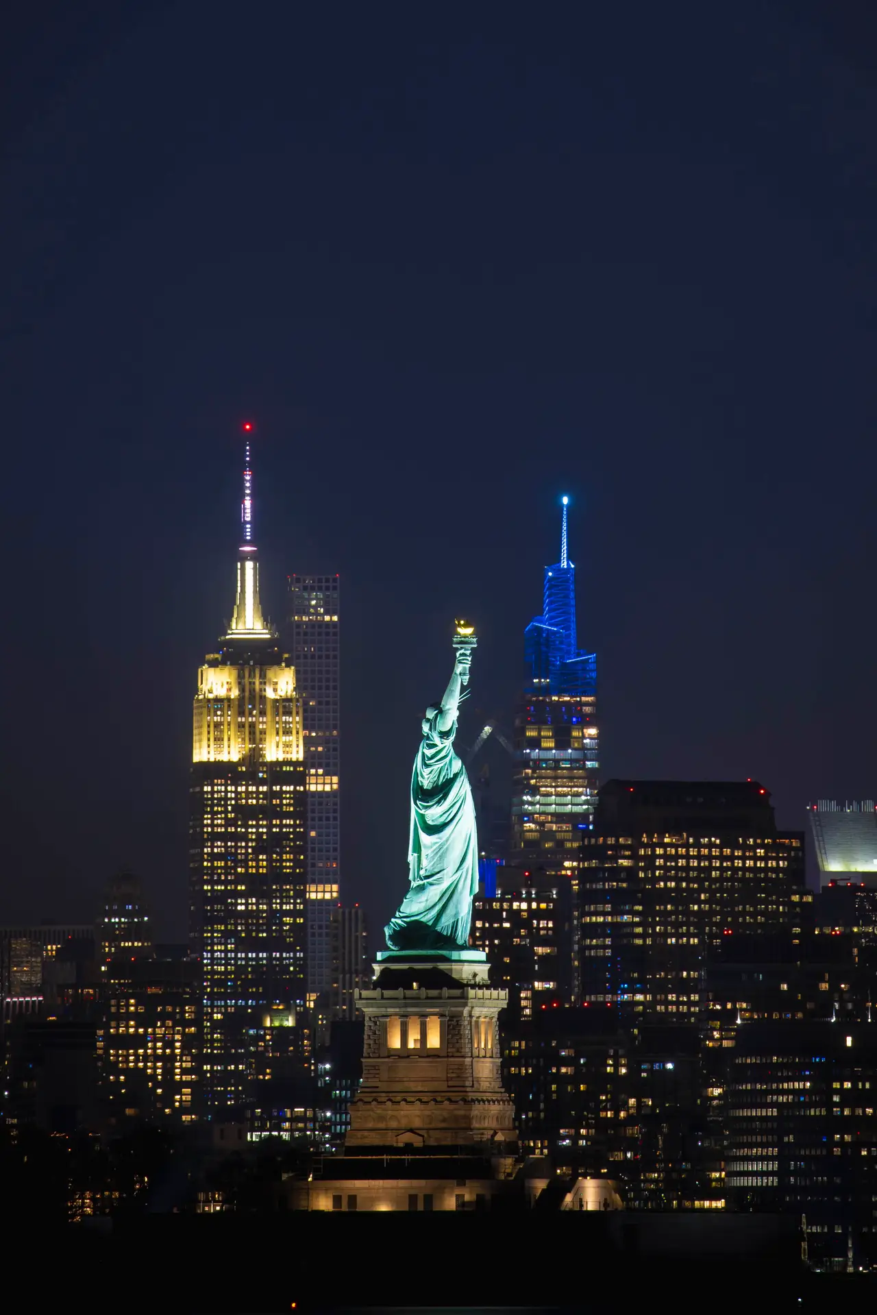 Fine-art photograph, “Statue of Liberty and Empire State at Night, Windows at Dusk - RFIV9558.JPG,” from the New York City collection.