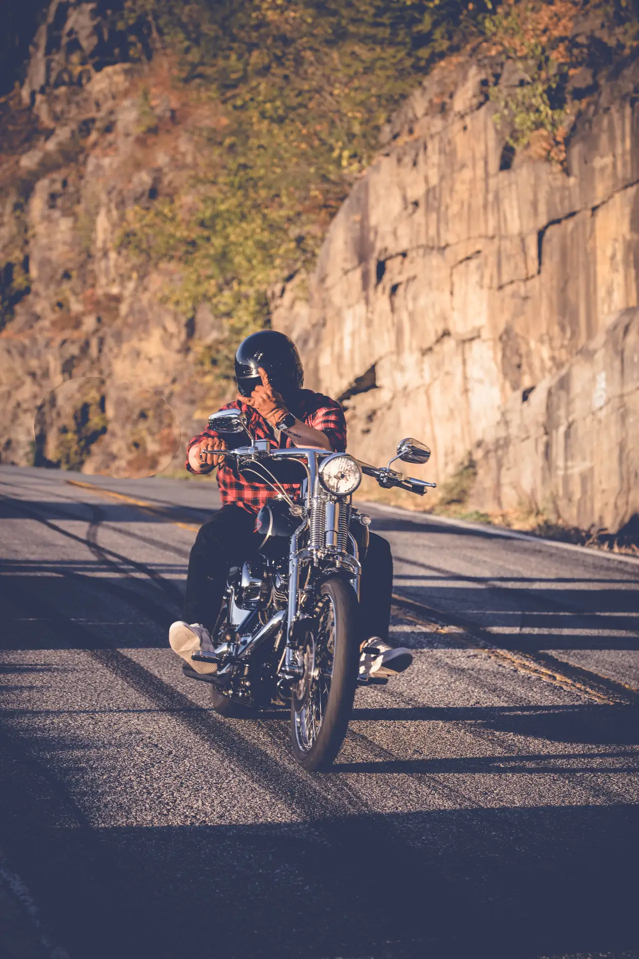 Fine-art photograph, “Adirondack Motorcyclist Beside a Rock Wall - 5M2A1136.JPG,” from the New York State collection.