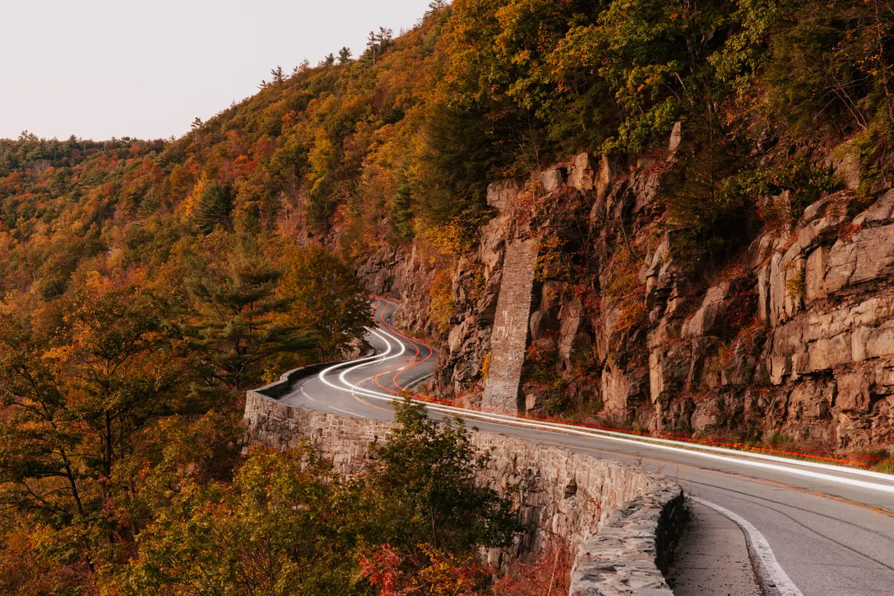 Fine-art photograph, “Adirondack Mountain Road Through Autumn Cliffs - 5M2A1364.JPG,” from the New York State collection.
