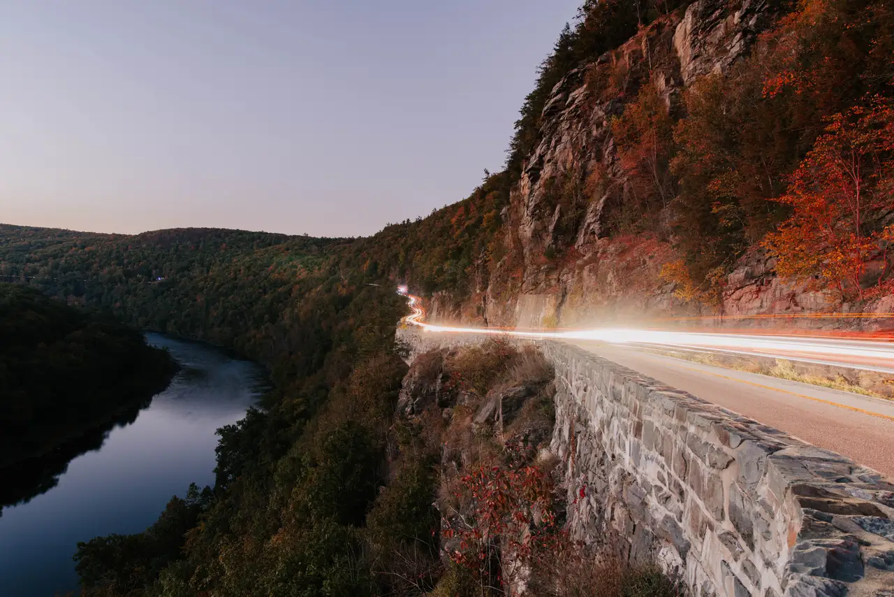 Fine-art photograph, “Adirondack Mountain Road Light Trails Beside the River - 5M2A1384.JPG,” from the New York State collection.