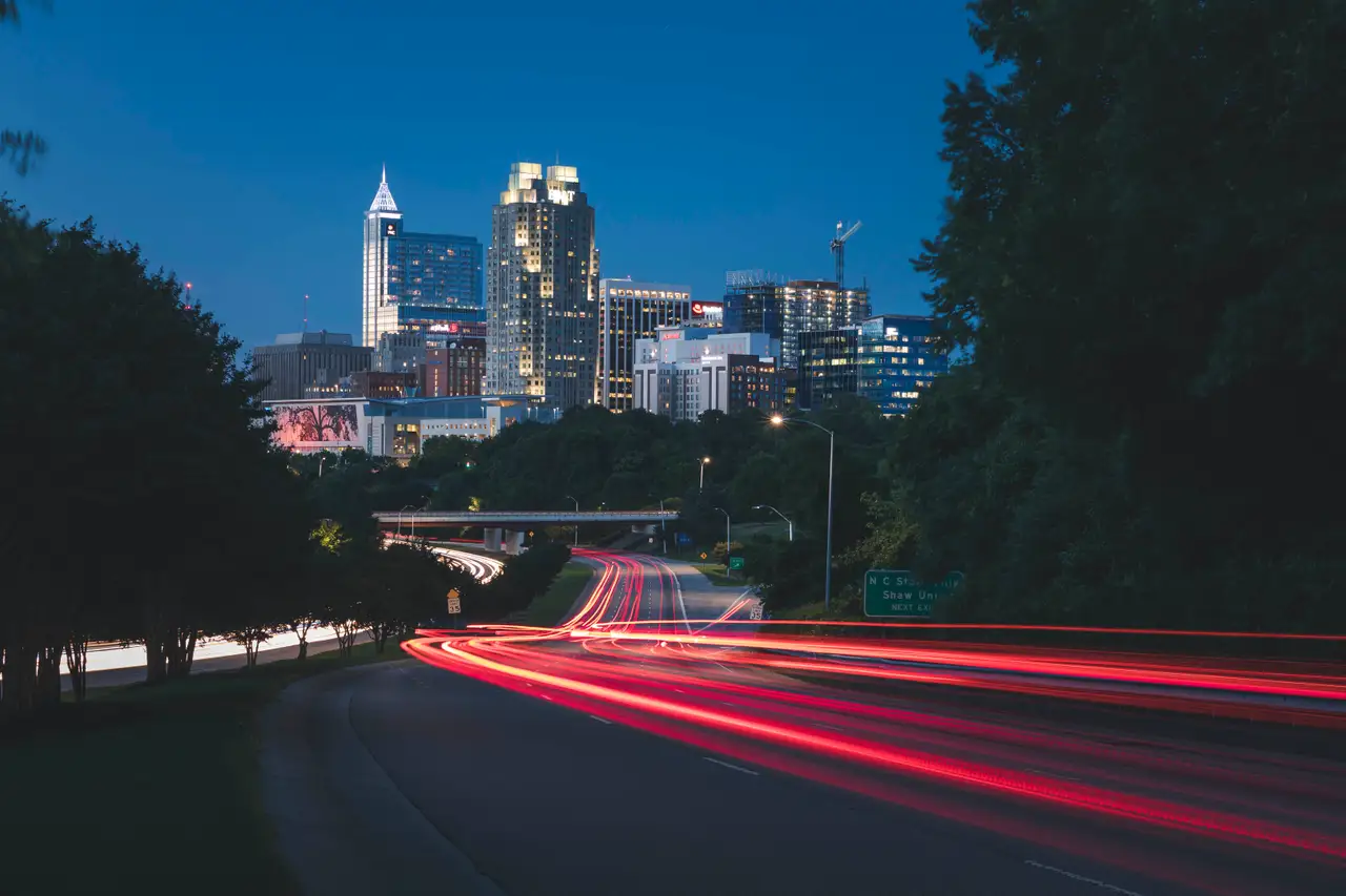 Fine-art photograph, “Raleigh Skyline Light Trails, Blue Silence - 5DM44423.JPG,” from the North Carolina collection.