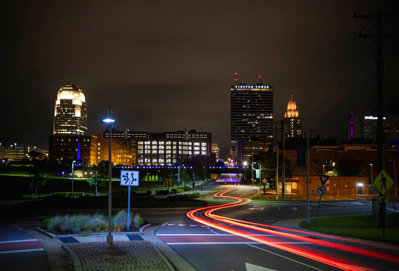 Fine-art photograph, “Winston-Salem Skyline Light Trails, Last Warmth - RFIV9714.JPG,” from the North Carolina collection.