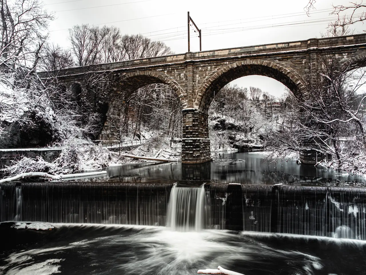 Fine-art photograph, “Stone Arch Bridge and Winter Waterfall, The Long Descent - RFIV5521,” from the Pennsylvania - Philly collection.