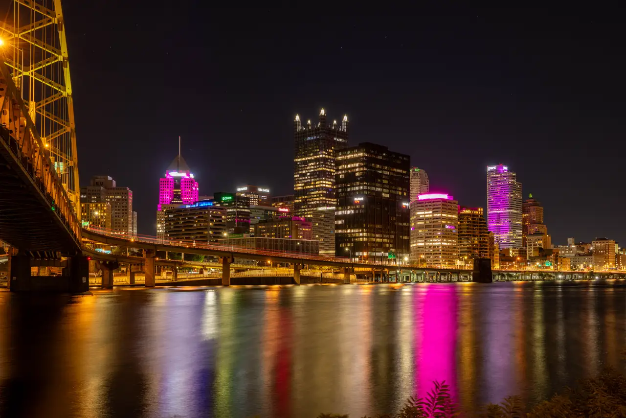 Fine-art photograph, “Pittsburgh Skyline Beneath a Yellow Bridge, Distant Glow - 5M2A1559,” from the Pennsylvania - Pittsburgh collection.