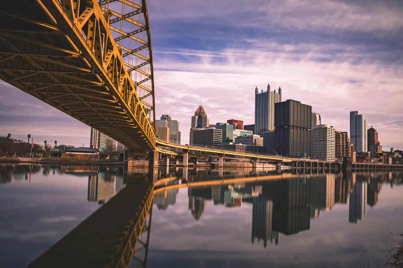 Fine-art photograph, “Pittsburgh Skyline Beneath a Yellow Bridge, Dawn Traffic - FIV8523,” from the Pennsylvania - Pittsburgh collection.
