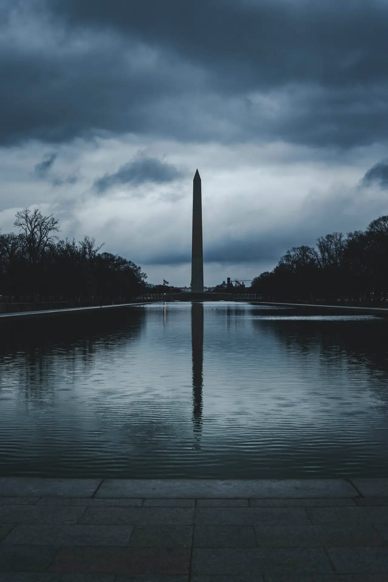 Fine-art photograph, “Washington Monument Beneath Storm Clouds, Last Train Home - RFIV2671,” from the Washington D.C. collection.