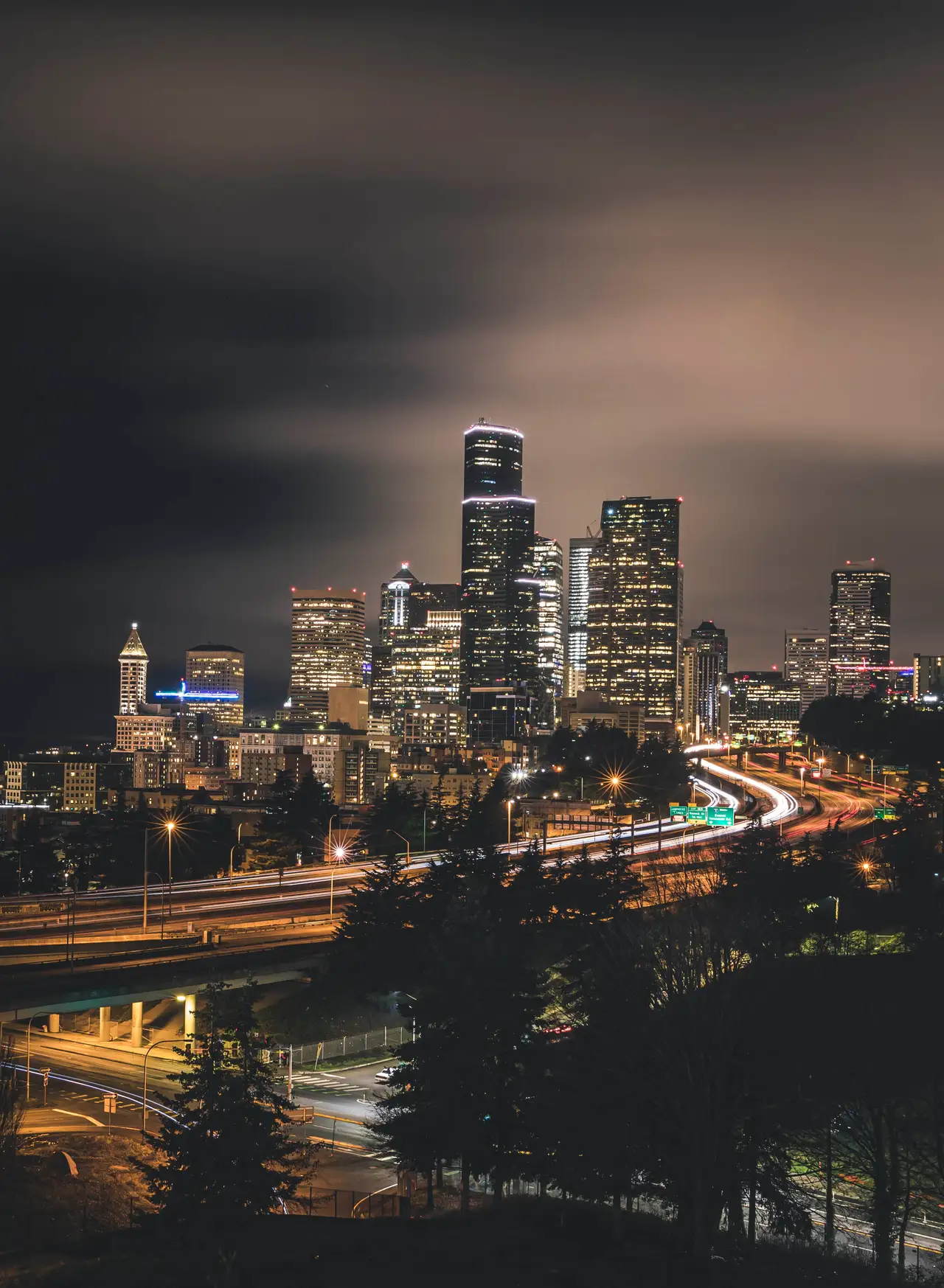 Fine-art photograph, “Seattle Skyline and Highway Light Trails in Vertical - 5DM48492,” from the Washington State collection.
