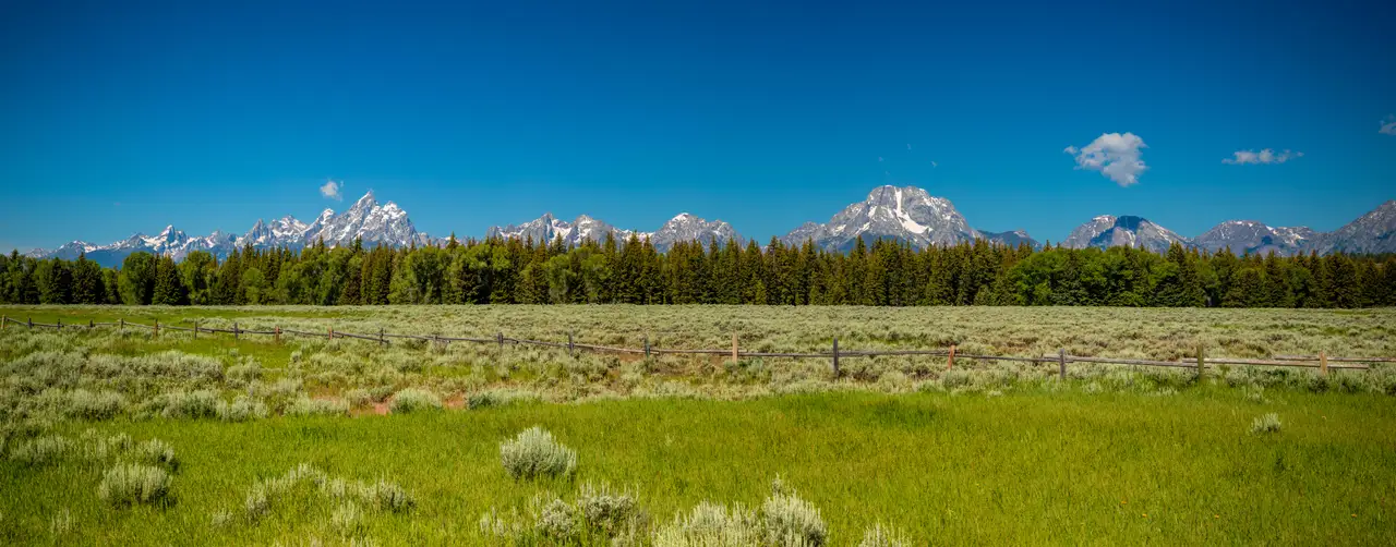 Fine-art photograph, “Tetons Across the Meadow Panorama,” from the Wyoming collection.